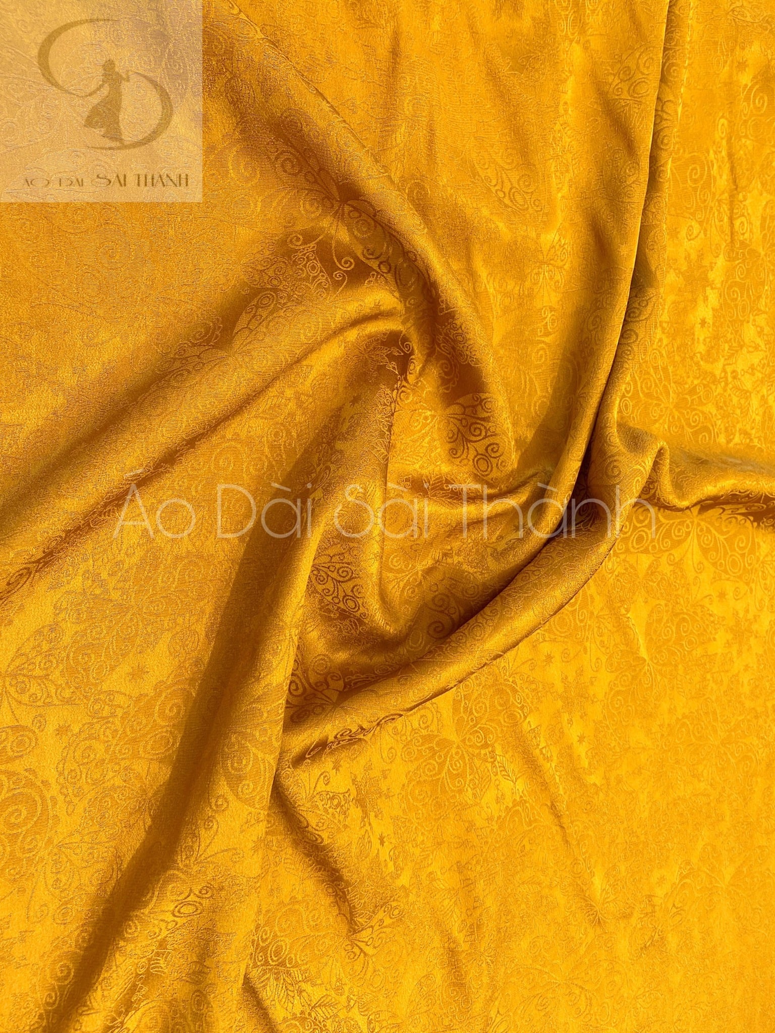 BL010- Vải áo dài lụa tơ tằm bảo lộc  vân bướm màu vàng đồng