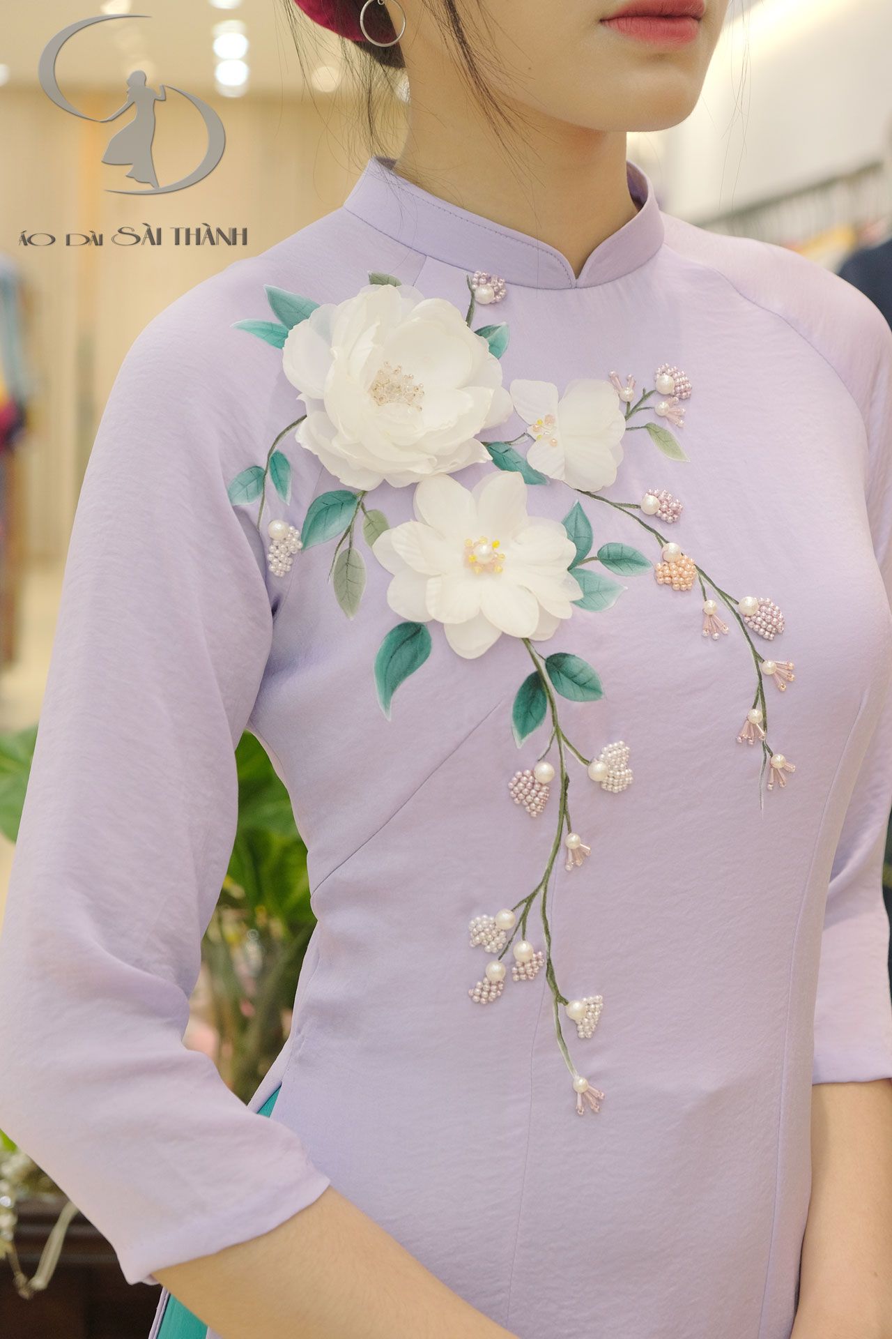 Tt0036- Áo Dài Tím Cà Đính Hoa Cát Tường – Áo Dài Sài Thành