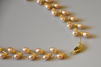 khop hai dau khoa vao nhau la chiec vong co ngoc trai cua ban da hoan thanh roi