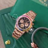 Đồng Hồ Rolex Cosmograph Daytona Rainbow 116595RBOW Rep 1:1 Cao Cấp Vỏ Vàng Hồng Niềng Bezel Đính Ruby Cầu Vồng Mặt Đen Dây Kim Loại