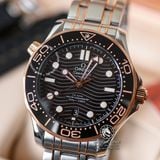 Đồng Hồ Omega Seamaster Diver 300M Co‑Axial Master Chronometer 42 mm 210.20.42.20.01.001 Rep 1:1 Chế Tác Vỏ Demi Vàng Hồng Mặt Đen Dây Kim Loại