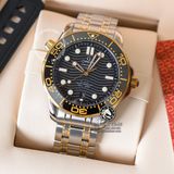 Đồng Hồ Omega Seamaster Diver 300M Co‑Axial Master Chronometer 42 mm 210.20.42.20.01.002 Rep 1:1 Chế Tác Vỏ Demi Vàng Kim Mặt Đen Dây Kim Loại