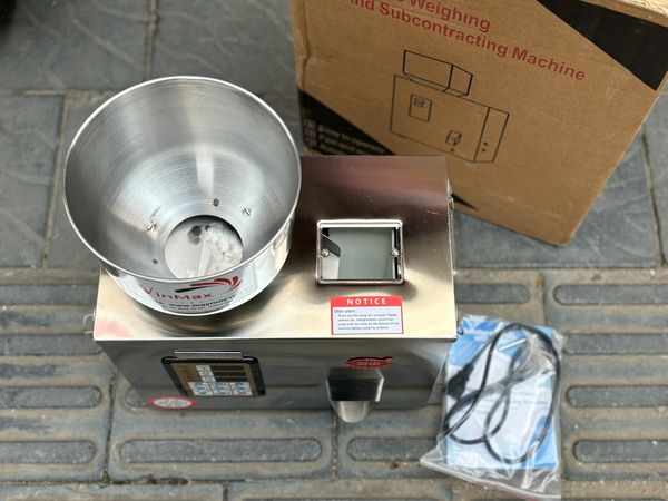 Máy đóng gói cân định lượng VMC50