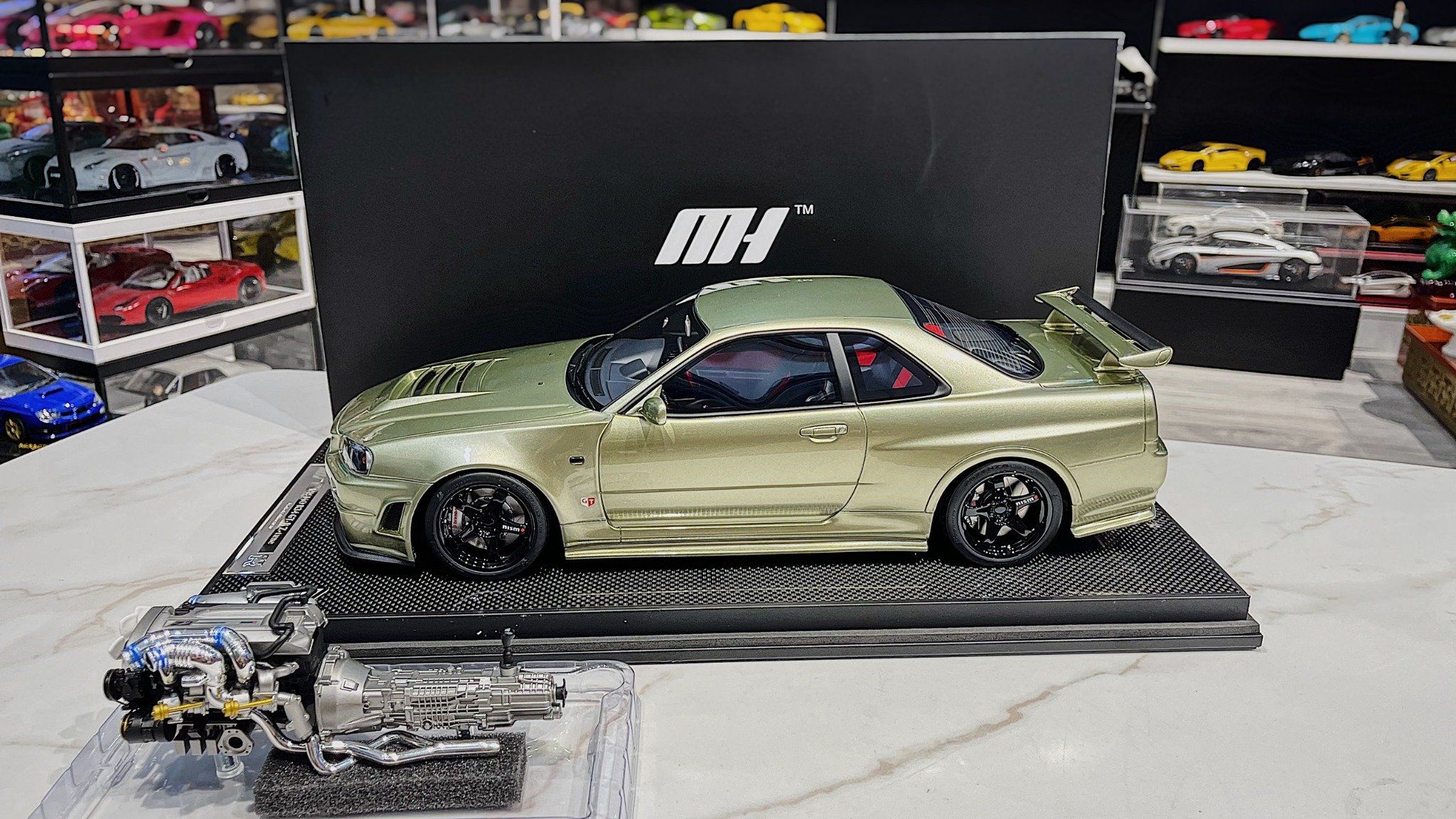 XE MÔ HÌNH NISSAN R34 GTR SKYLINE MILLIUM JADE,TỶ LỆ 1/12 MOTORHELIX