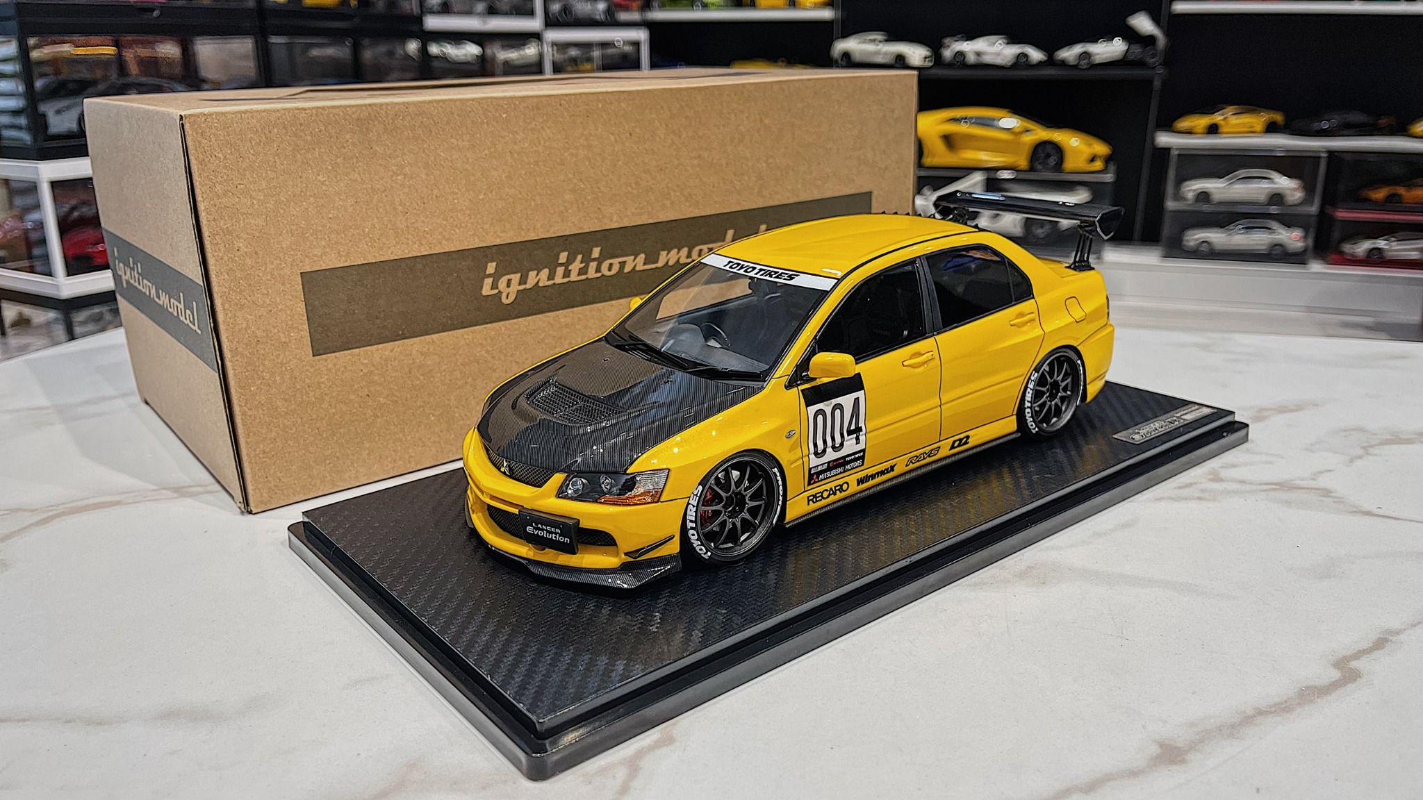 XE MÔ HÌNH MITSUBISHI LANCER EVOLUTION IX YELLOW,TỶ LỆ 1/18 IGNITION