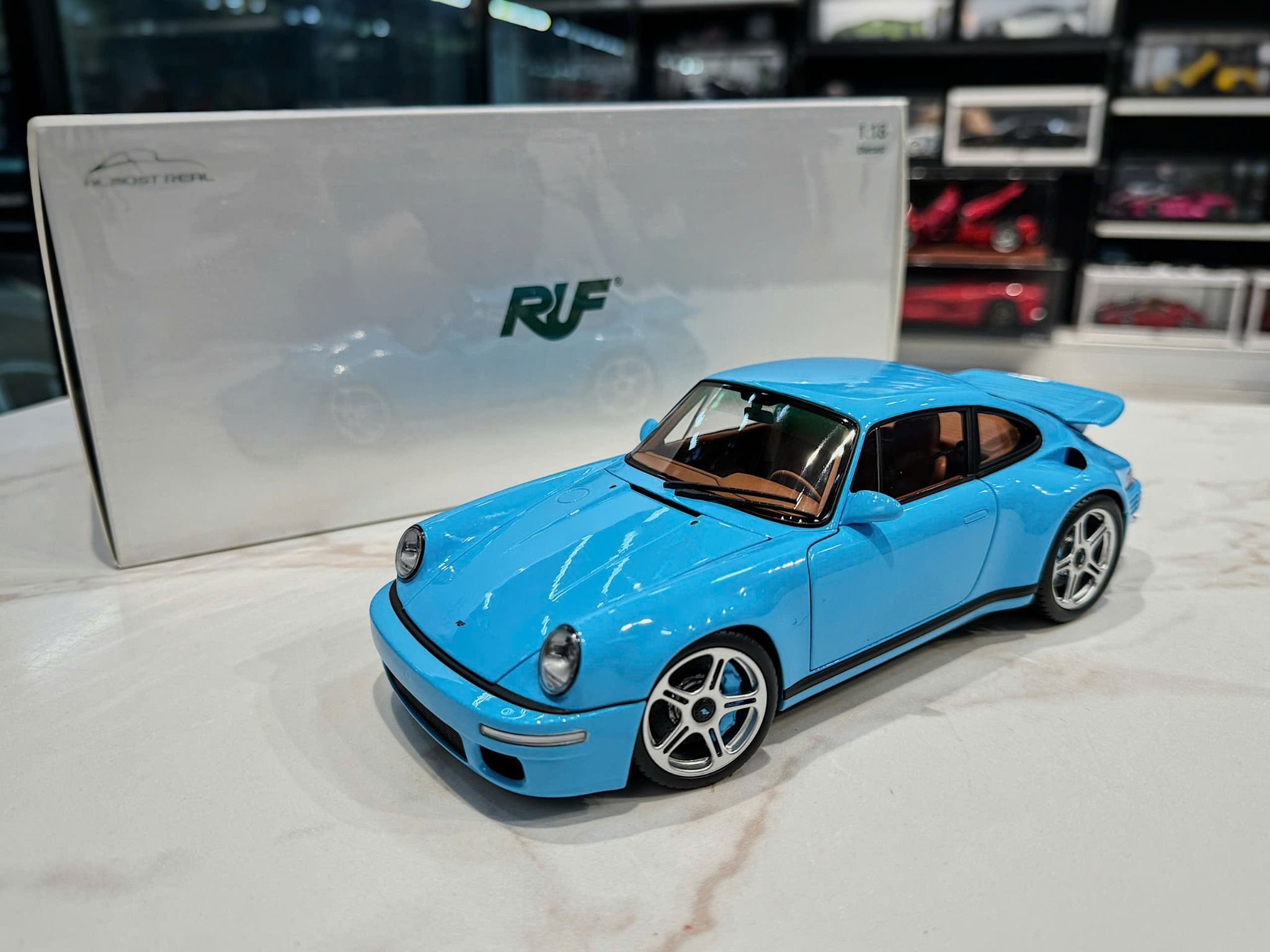 XE MÔ HÌNH PORSCHE 911 RUF BABY BLUE,TỶ LỆ 1/18 ALMOST REAL