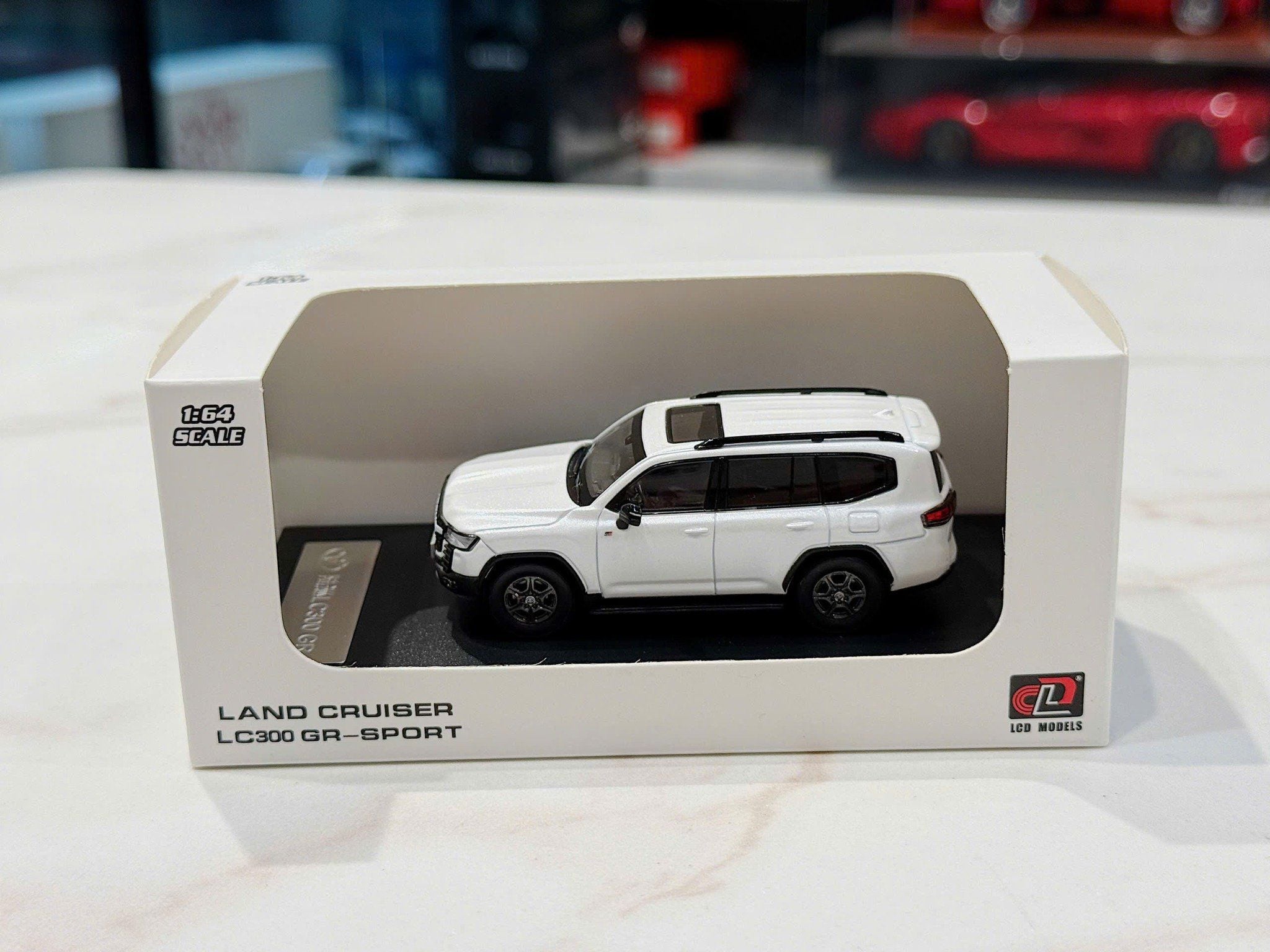 XE MÔ HÌNH TOYOTA LAND CRUISER LC300 GR-SPORT,TỶ LỆ 1/64 LCD
