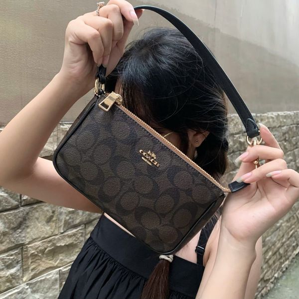 808 - Túi Coach kẹp nách Nolita 19 In Signature Canvas - CS442