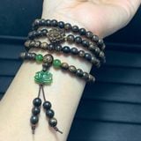  Vòng tay Trầm hương sánh 6mm mix bi vàng và sen ngọc bích 