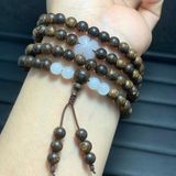  Vòng tay Trầm hương sánh chìm mix cỏ 4 lá và đá bạch ngọc 