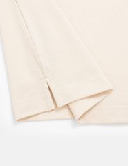 Áo phông có cổ nam mắt chim xẻ tà dáng ôm