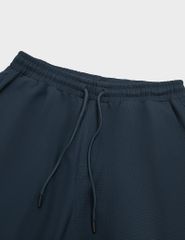 Quần short nam dệt kim ép gấu dáng ôm vừa