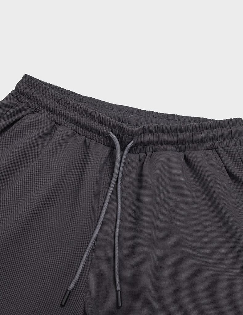 Quần short nam dệt kim ép gấu dáng ôm vừa