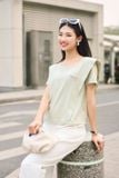  Áo phông nữ chất cotton cổ tròn vai cách điệu tag kim loại ngực 