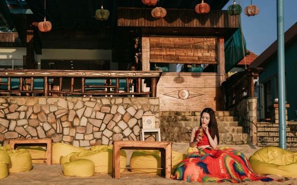 The girl sitting at the beach of Orange Resort Phu Quoc