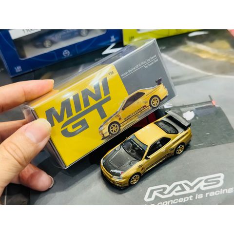  Xe mô hình MINI GT 1/64 Nissan Skyline GT-R R34 Top Secret Gold Right Handle 