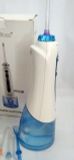  Tăm nước H2o Floss độ mới cao với 5 đầu bàn chải, túi vải đựng và sạc đi kèm 