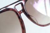  Kính râm cổ điển màu mai rùa Nikon hàng chục năm tuổi. Kính bản to đeo chống nắng chống bụi tốt. 
