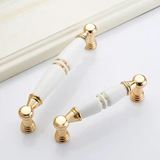  Tay nắm tủ gốm sứ vàng trắng (cái) 