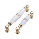  Tay nắm tủ gốm sứ vàng trắng (cái) 