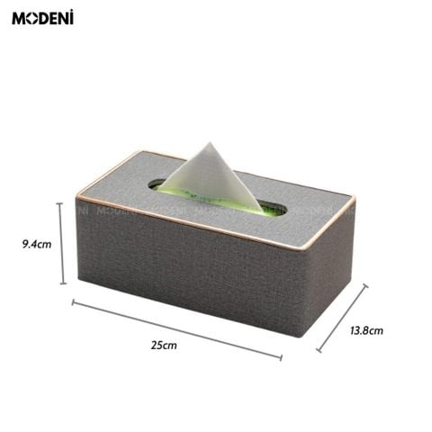 Hộp khăn giấy Modeni Xám Tro vải lanh cao cấp phối viền vàng hồng sang trọng đặt trên bàn làm việc.