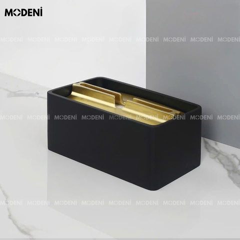 Hộp khăn giấy Noira nhựa ABS cao cấp với nắp mạ vàng sang trọng đặt trên bàn ăn hiện đại.