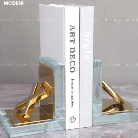 Chặn sách kính trong suốt phối vàng hiện đại đặt trên bàn làm việc sang trọng