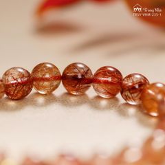 Vòng thạch anh tóc đỏ 8 li mix trụ Om mani vàng (TRSV VHM 235-1 )