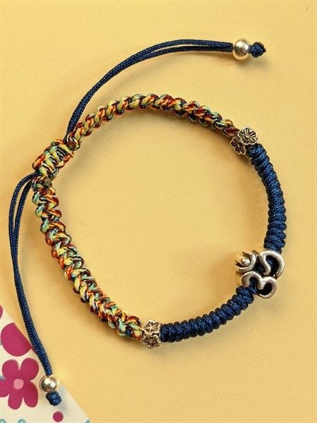 Vòng tết dây xanh coban mix ngũ sắc charm chữ Om (VHM 185)