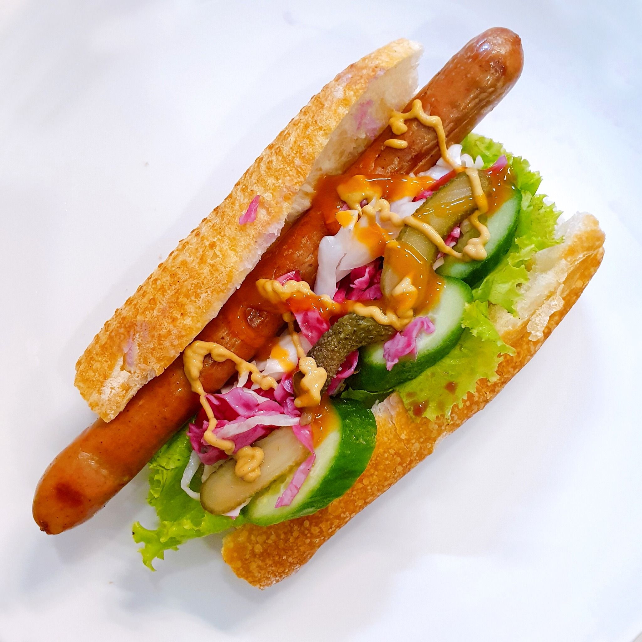  Hotdog (German sausage random kind, fresh veggies, pickles, mustard/chili sauce/ketchup) 