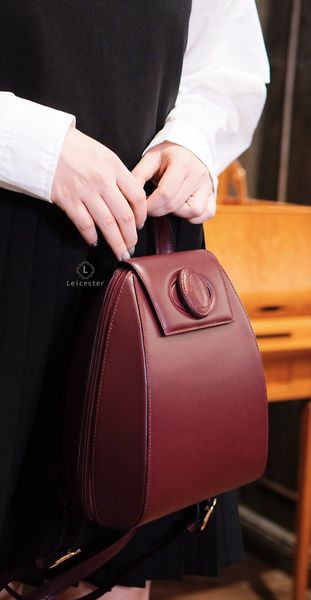 CARTIER BURGUNDY TURNLOCK BACKPACK 