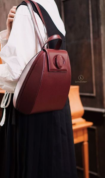  CARTIER BURGUNDY TURNLOCK BACKPACK 