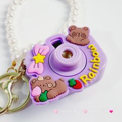 Móc Khóa Máy Ảnh Gấu tím Rainbow Có đèn kèm charm ngọc trai