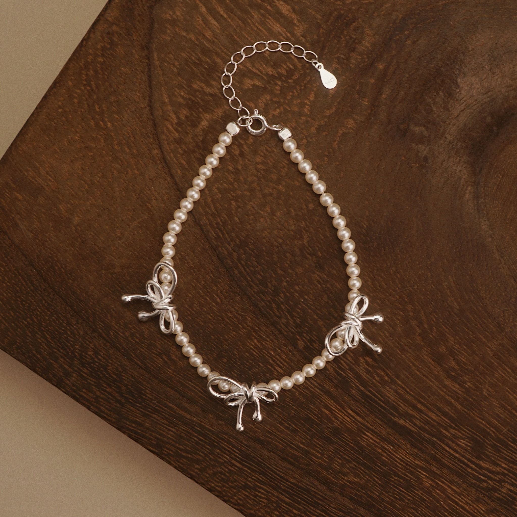  TRIPLE BOW ROUND PEARL BRACELET (S) 