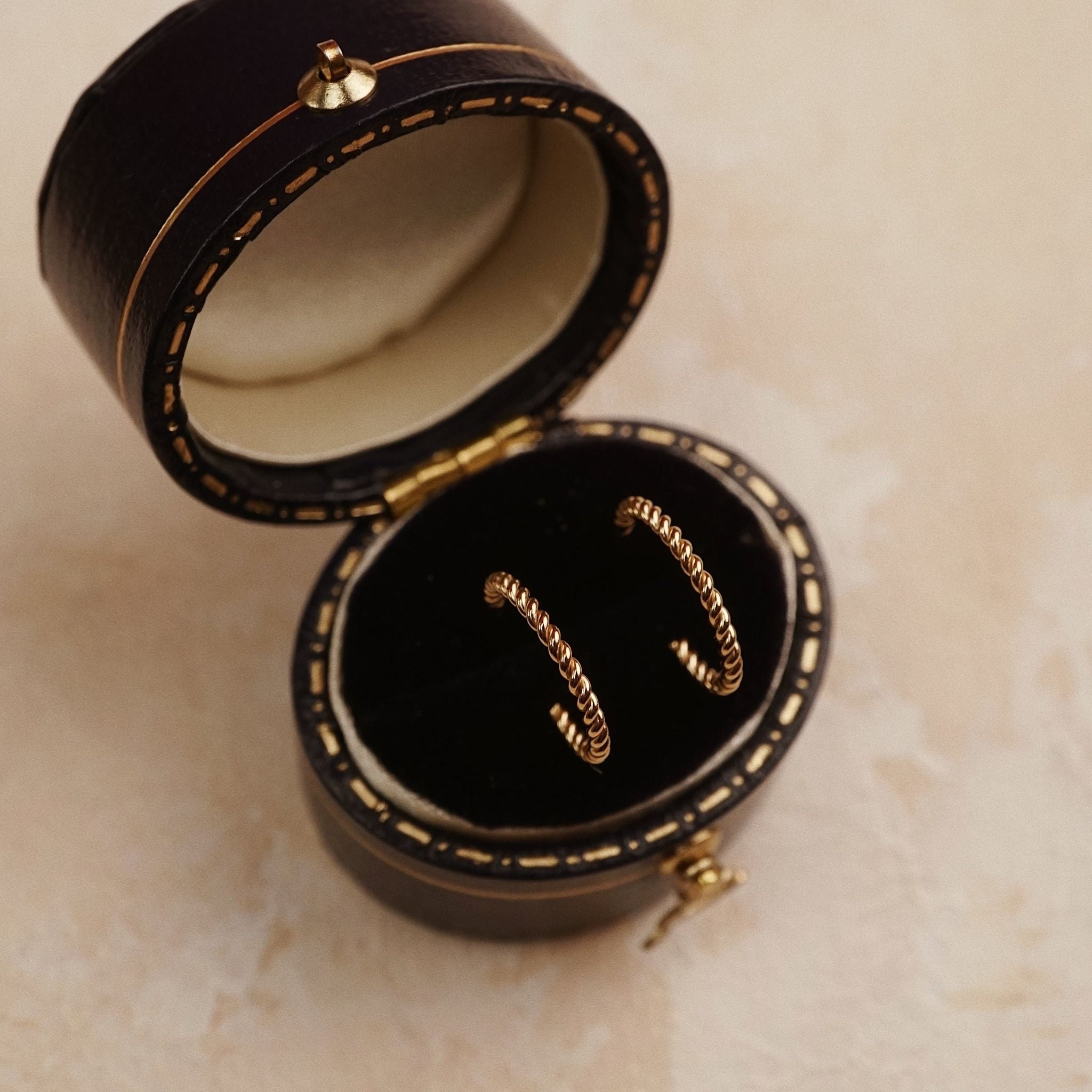  TWIST OPEN HOOP EARRINGS 