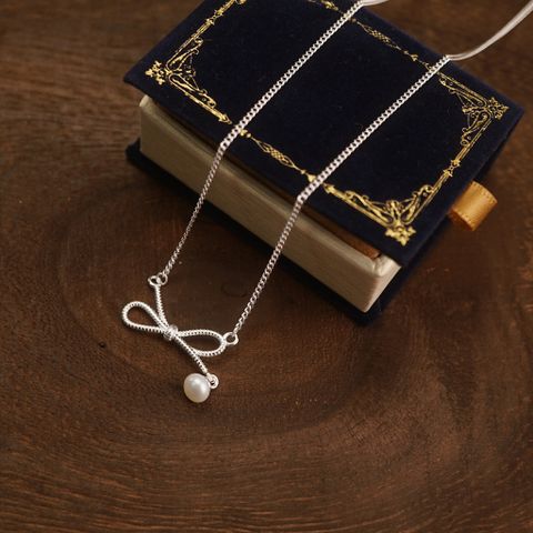 BOW TWIST DROP PEARL NECKLACE (S)
