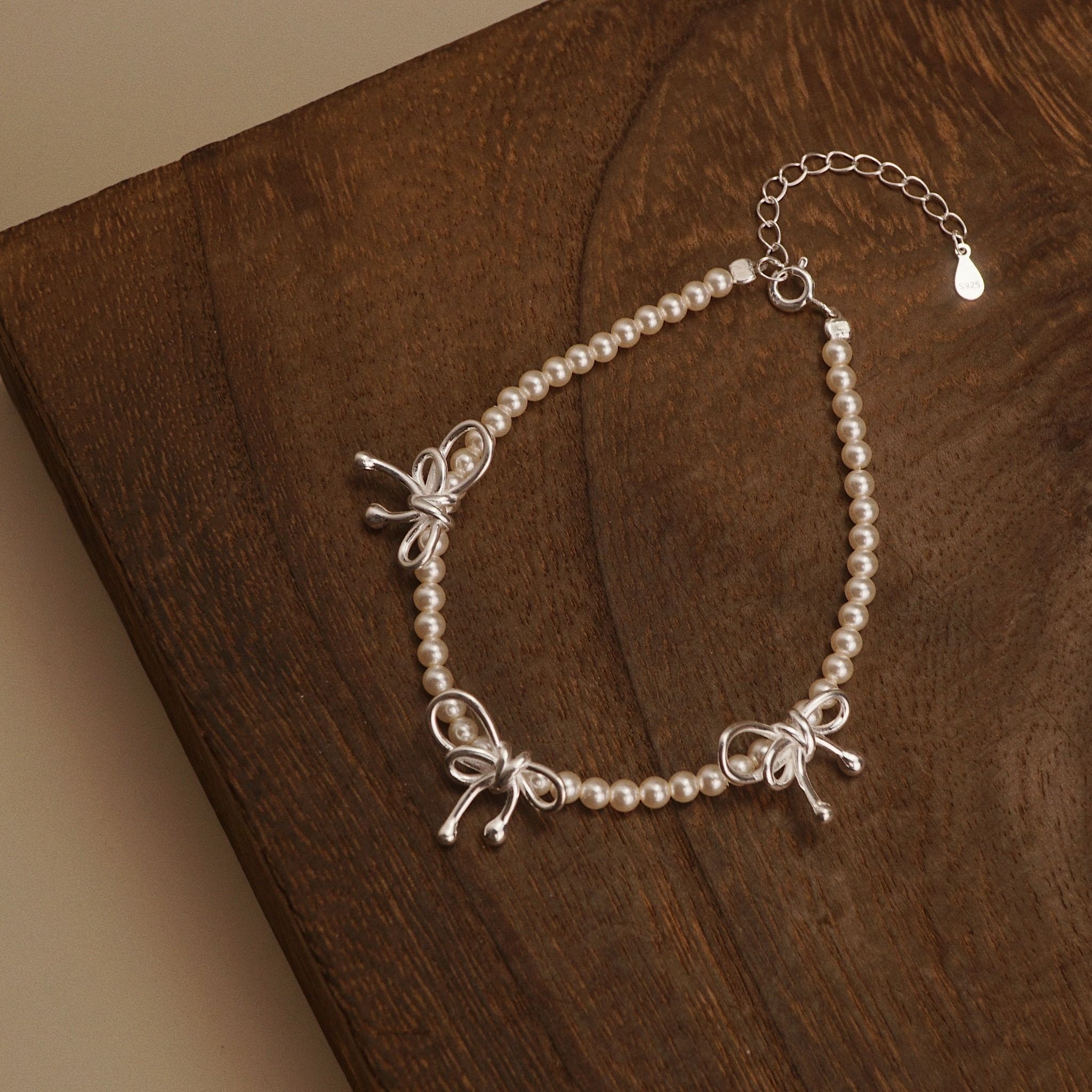 TRIPLE BOW ROUND PEARL BRACELET (S) 