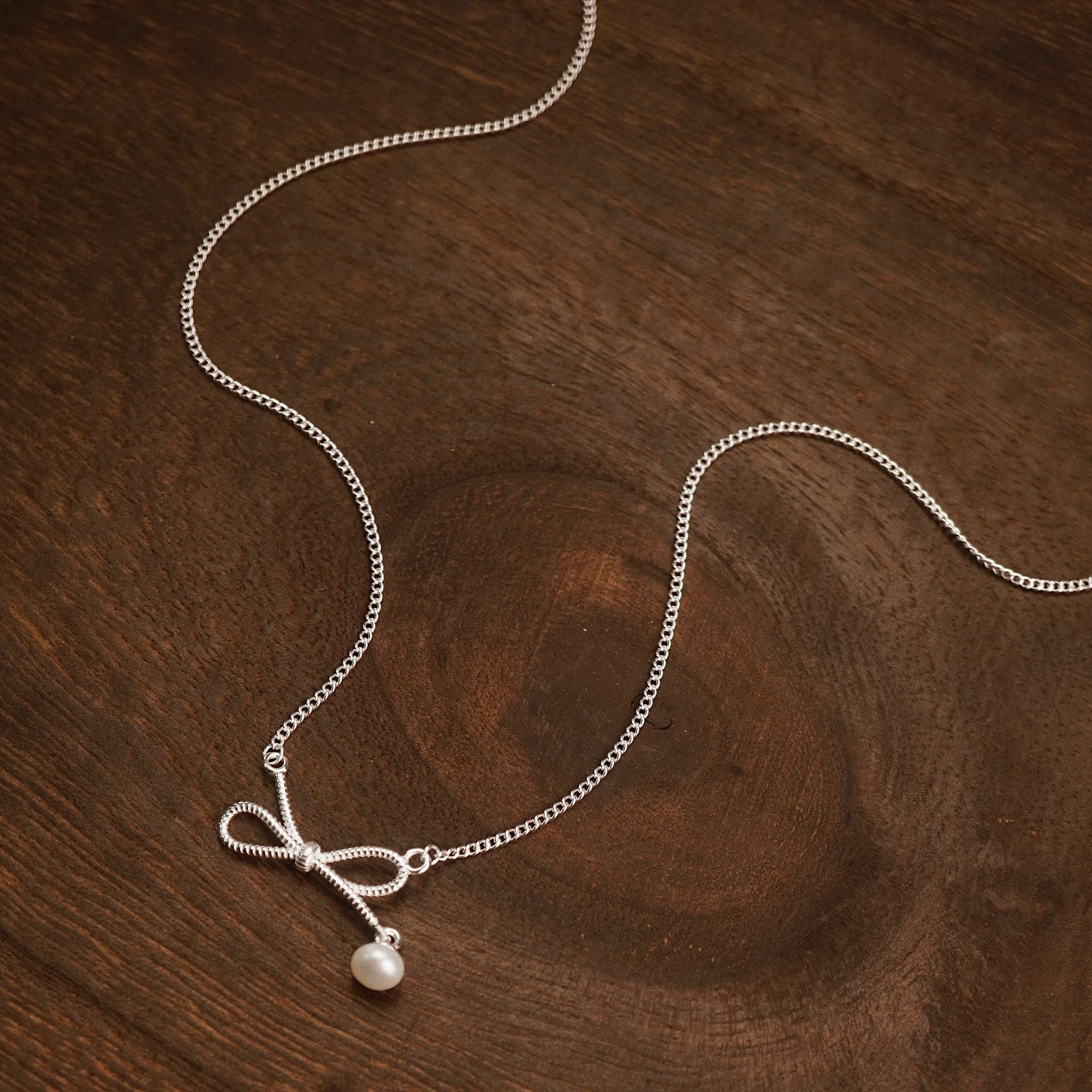  BOW TWIST DROP PEARL NECKLACE (S) 
