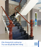  Cầu thang kính trụ cao ốp gỗ 