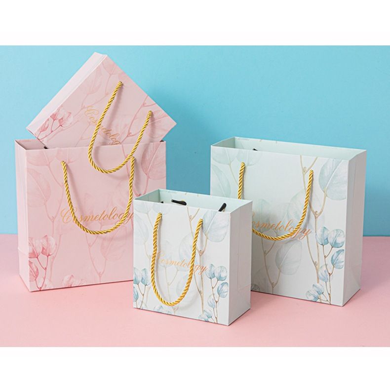  [GIAO HÀNG 7-25 NGÀY] COMBO 100 Túi giấy quai xách họa tiết hoa lá màu hồng,xanh pastel đính kèm ruy băng nơ Q1888 