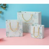  [GIAO HÀNG 7-25 NGÀY] COMBO 100 Túi giấy quai xách họa tiết hoa lá màu hồng,xanh pastel đính kèm ruy băng nơ Q1888 