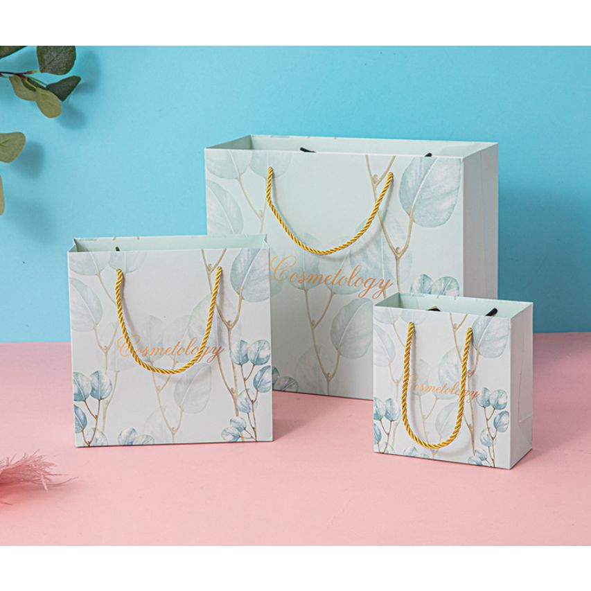  [GIAO HÀNG 7-25 NGÀY] COMBO 100 Túi giấy quai xách họa tiết hoa lá màu hồng,xanh pastel đính kèm ruy băng nơ Q1888 