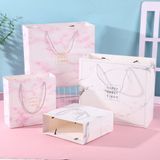  [GIAO HÀNG 7-25 NGÀY] COMBO 100 Túi giấy quai xách họa tiết hoa lá màu hồng,xanh pastel đính kèm ruy băng nơ Q1888 