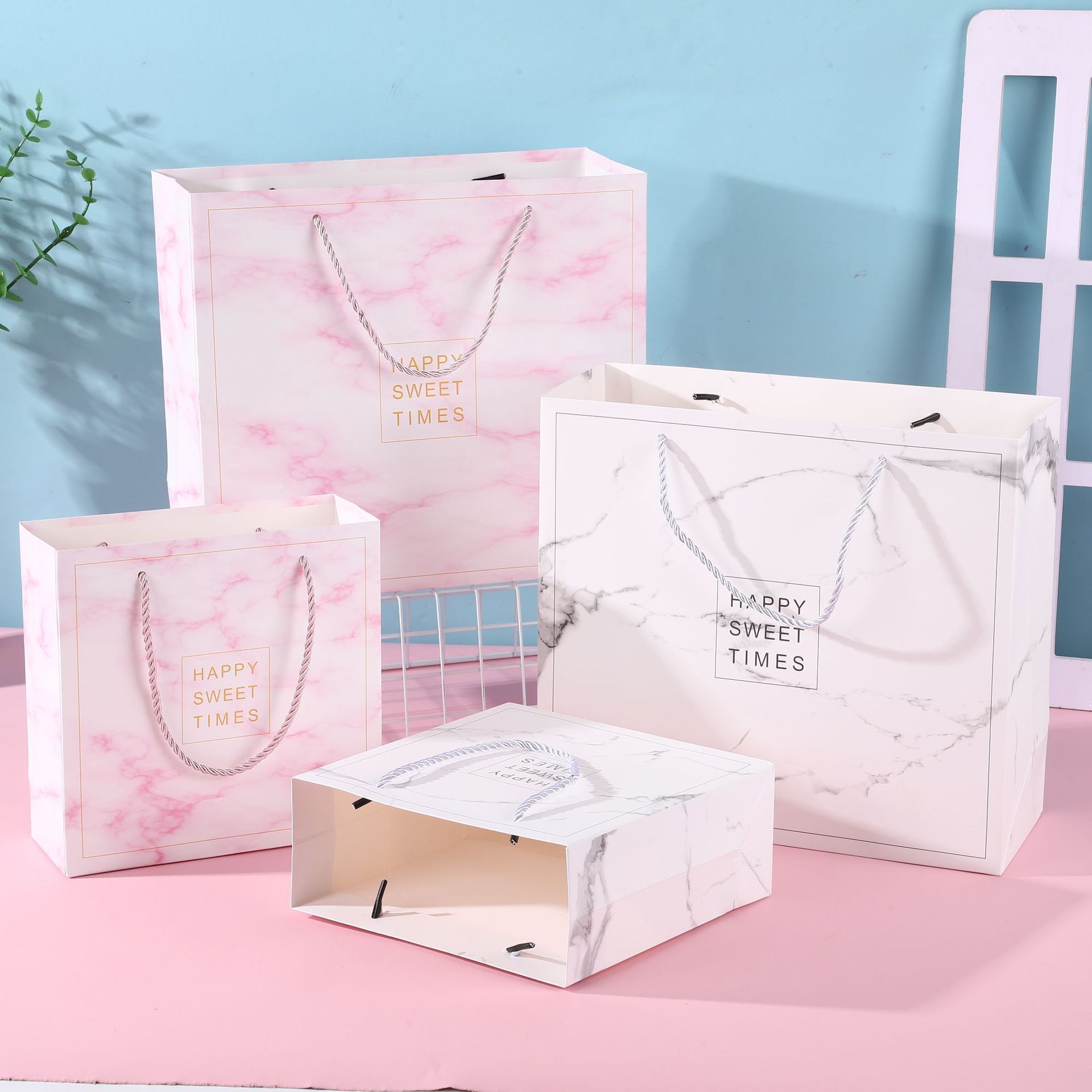  [GIAO HÀNG 7-25 NGÀY] COMBO 100 Túi giấy quai xách họa tiết hoa lá màu hồng,xanh pastel đính kèm ruy băng nơ Q1888 