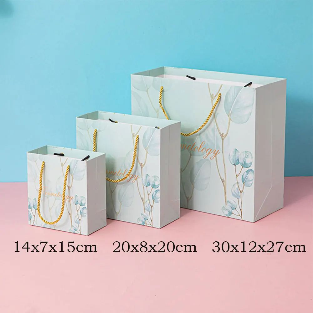  [GIAO HÀNG 7-25 NGÀY] COMBO 100 Túi giấy quai xách họa tiết hoa lá màu hồng,xanh pastel đính kèm ruy băng nơ Q1888 