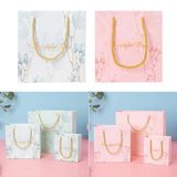  [GIAO HÀNG 7-25 NGÀY] COMBO 100 Túi giấy quai xách họa tiết hoa lá màu hồng,xanh pastel đính kèm ruy băng nơ Q1888 