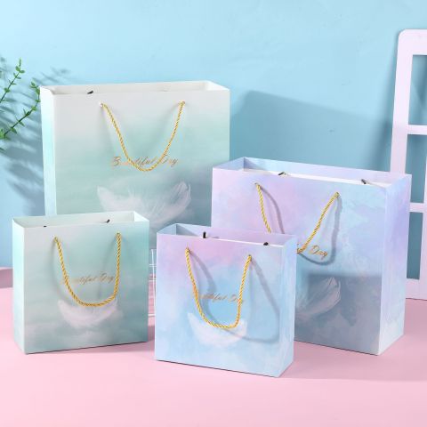  [GIAO HÀNG 7-25 NGÀY] COMBO 100 Túi giấy quai xách họa tiết hoa lá màu hồng,xanh pastel đính kèm ruy băng nơ Q1888 