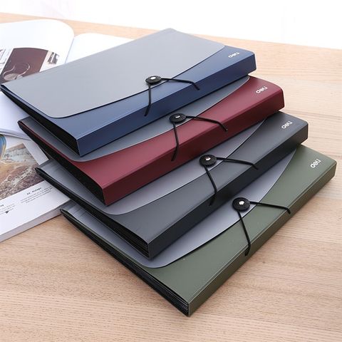 Cặp xốp 7 ngăn quấn dây 4 màu giao ngẫu nhiên Deli E38151 (24)