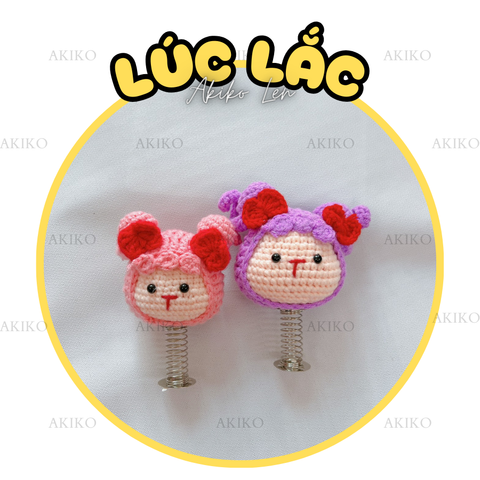 Lúc Lắc Bé Cột Nơ Đỏ