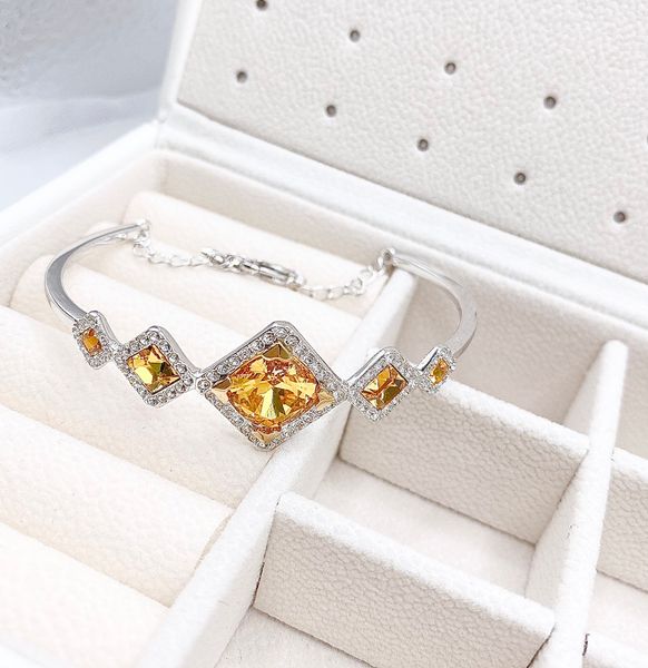  Lắc cứng Swarovski màu amber - Swarovski Carina Sunflower Amber Crystal Rhodium Plated Bangle 